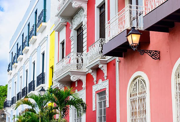 Cobblestone street lined with pastel colonial buildings and Spanish balconies in Old San Juan